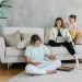 A family enjoying quality time together in a cozy living room setting, bonding and working.